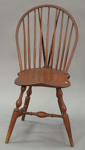 Windsor braced bowback side chair with saddle seat all set on bold turned legs, probably Connecticut 18th century. 
ht. 37 in.; seat...