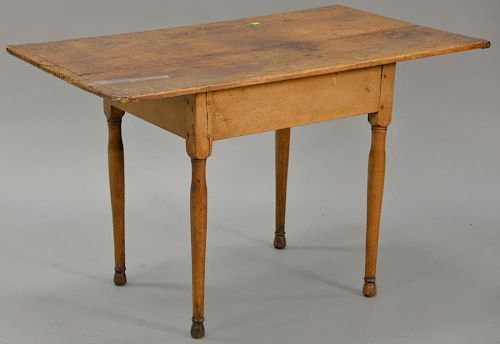 Queen Anne center table having breadboard top on plain frieze on turned legs, 18th century (original top). 
ht. 27 in.; top: 24 3/4"...