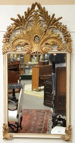 Large French mirror having top carved with wheat, leaves, and flowers.

67" x 34"