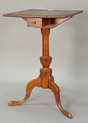 Federal cherry candlestand having square top with molded edge over one drawer over turned urn shaft with cabriole legs on pad feet....
