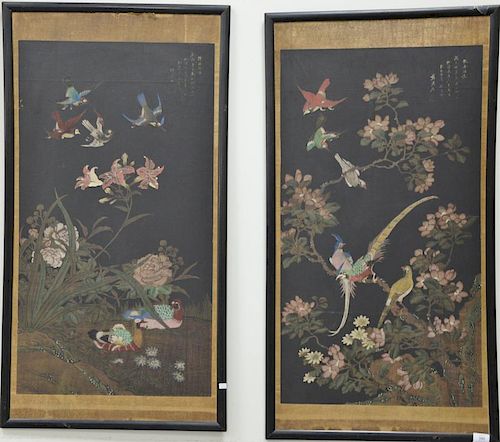 Pair of Oriental oil on black silk paintings of birds and wild blossoming flowers, signed top right corner. 
sight size 36" x 20"