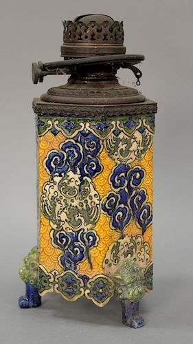 Majolica oil lamp mounted with brass and brass duplex font, all set on foo dog and scrolled feet, 19th century. 
ht. 13 1/2 in.