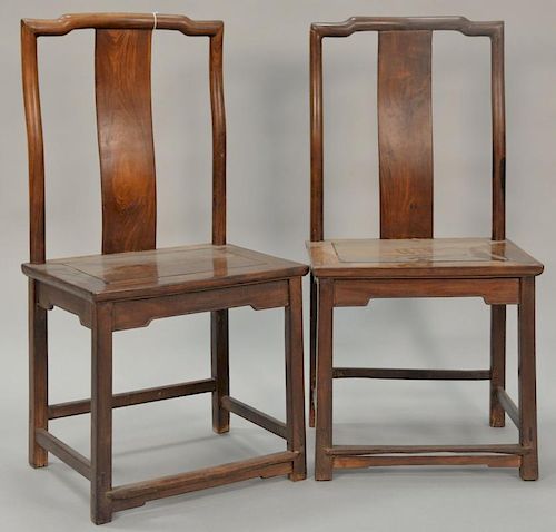 Pair of Huanghuali side chairs having continuous yoke back with plain splat and wood seat above mortised apron, 18th/19th century or earlier. seat ht.