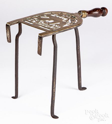 Engraved brass and iron trivet, 19th c.