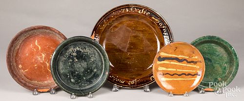 Five redware plates and undertrays, 19th c.