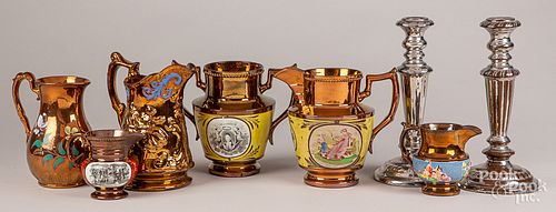 Six lustre pitchers and a pair of candlesticks