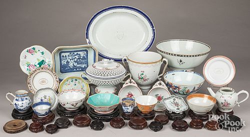Large group of Chinese porcelain and carved stands