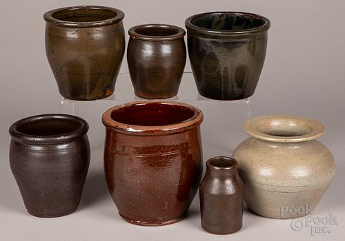 Seven stoneware and redware crocks