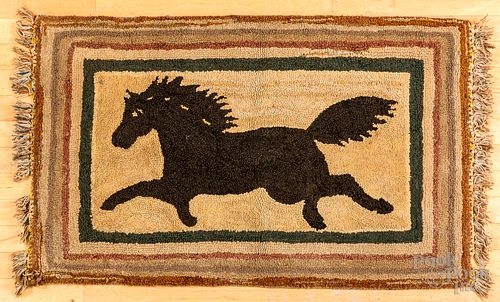 Hooked rug of a running horse