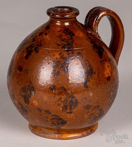 Pennsylvania redware ovoid jug, early 19th c.