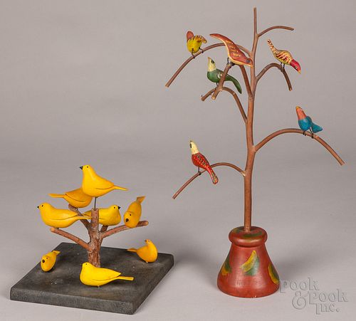 Two carved and painted bird trees