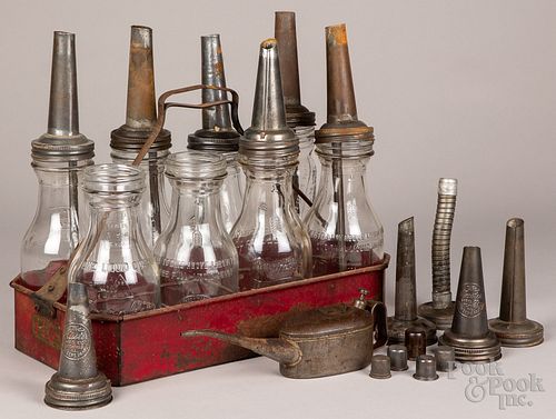 Group of oil bottles with rack, to include two Rap