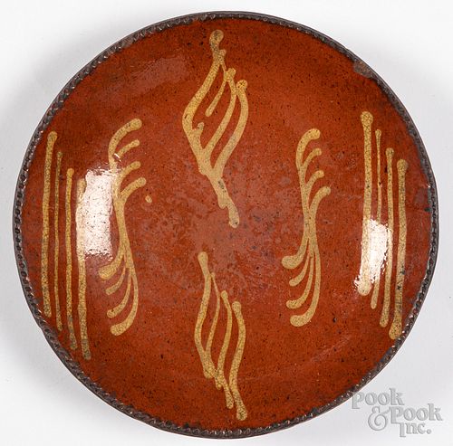 Pennsylvania slip decorated redware plate, 19th c.