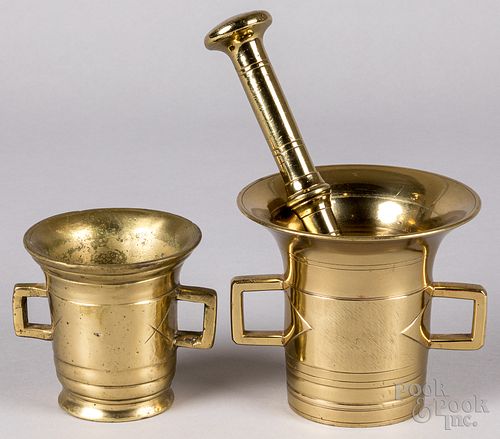 Two bell metal brass mortars and a pestle