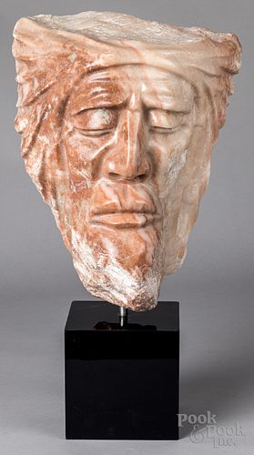 Carved stone face of a man