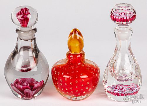 Three paperweight perfume bottles