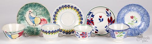 Three spatterware cups and saucers