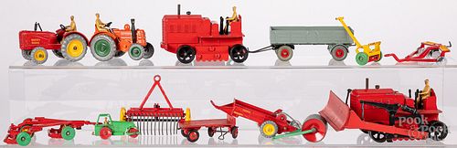 Twelve Dinky Toys farm related tractors, etc.