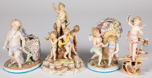 Four porcelain cherub figures, 20th c.