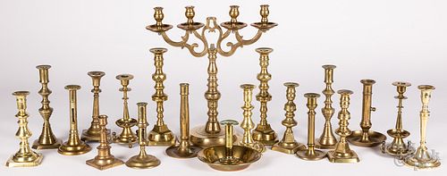 Group of brass candlesticks and candelabra