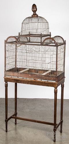 Large wire birdcage on a later mahogany stand