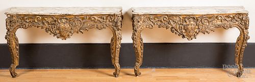 Pair of marble top giltwood console tables, 20th c