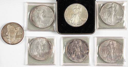 Seven 1 ozt. fine silver coins