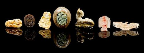 * Seven Carved Hardstone Toggles Height of largest 1 3/4 x width 2 1/4 x depth 3 1/4 inches.
