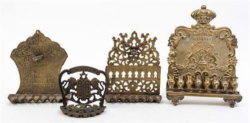 * A Group of Seven Brass Menorahs Height of tallest 18 1/4 inches.