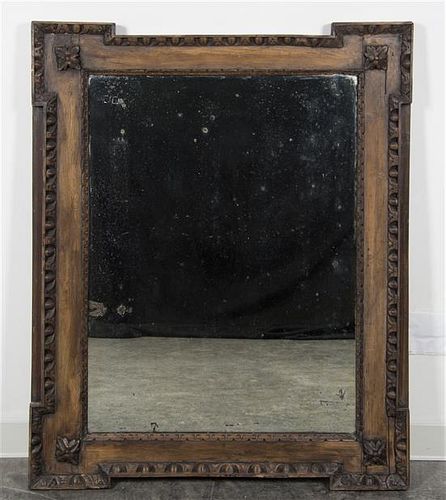 * A Continental Carved Walnut Mirror Height 49 x width 39 3/4 inches.