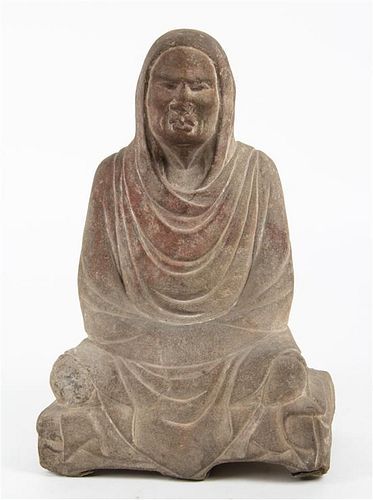 * A Carved Stone Figure Height 14 3/4 inches.