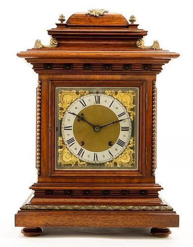 A Walnut and Brass Mantel Clock Height 18 inches.
