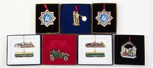 A Group of Seven Commemorative Christmas Ornaments Width of first 3 3/8 inches.