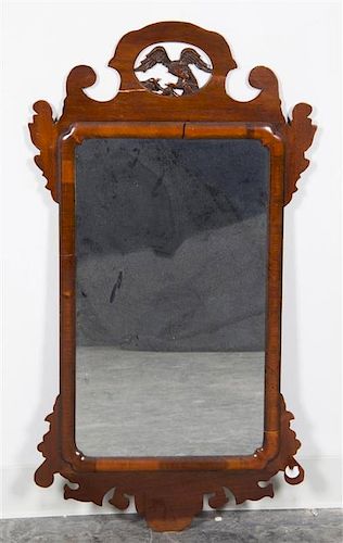 A Carved Wood Mirror Height 37 x width 19 1/2 inches.