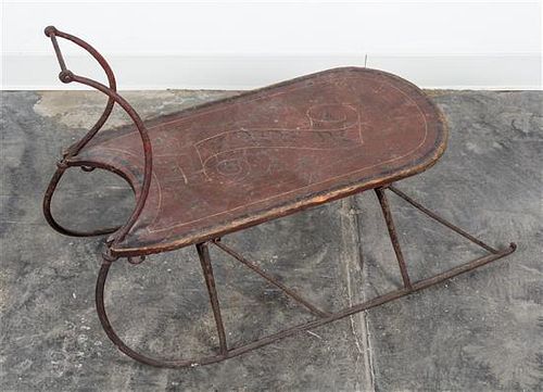 A Painted Wood and Metal Sled. Length overall 33 1/2 inches.
