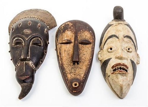 * A Group of Three Masks Height of first 19 inches.