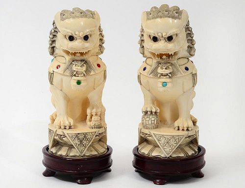 PAIR OF CARVED "JEWELED" IVORY FU DOGS