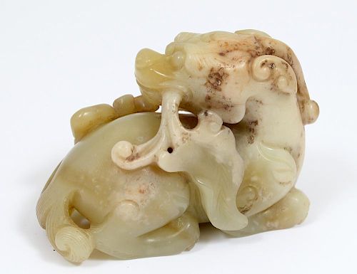CARVED YELLOW JADE FIGURE OF A MYTHICAL BEAST