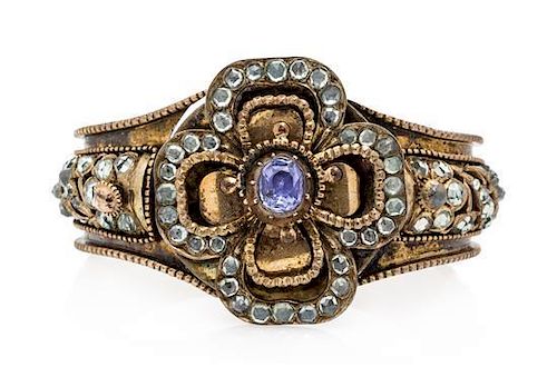 * A Victorian Gilt Metal, Sapphire and Multigem Bangle Bracelet, 30.80 dwts.