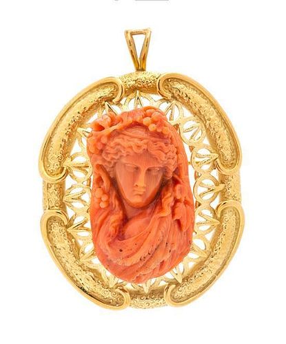 * An 18 Karat Yellow Gold and Coral Cameo Pendant/Brooch, 26.10 dwts.