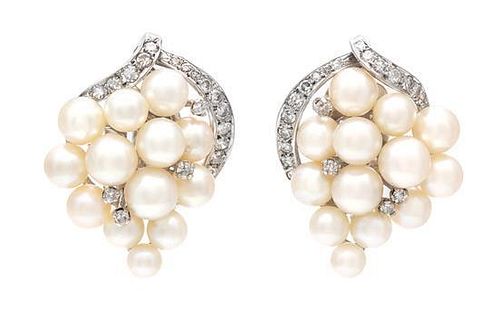 * A Pair of White Gold, Cultured Pearl and Diamond Earclips, 14.30 dwts.