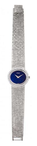 * An 18 Karat White Gold, Lapis Lazuli and Diamond Wristwatch, Piaget, 42.50 dwts.