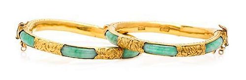 A Pair of High Karat Yellow Gold and Jade Bangle Bracelets, 44.10 dwts.