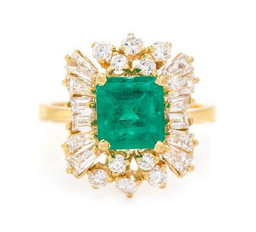 * An 18 Karat Yellow Gold, Emerald and Diamond Ring, 4.30 dwts.