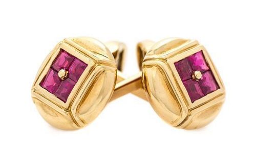 A Pair of 18 Karat Yellow Gold and Ruby Cufflinks, 12.10 dwts.