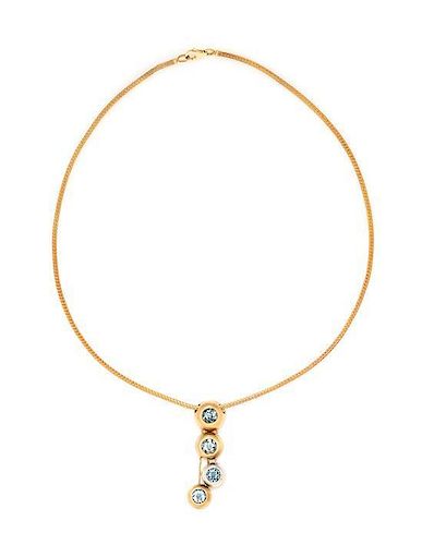 A Bicolor Gold and Aquamarine Pendant, 10.30 dwts.