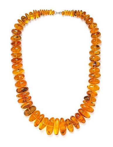 A Graduated Amber Bead Necklace,