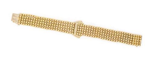 * An 18 Karat Yellow Gold and Diamond Buckle Motif Bracelet, 42.80 dwts.