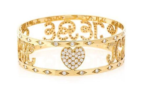 * An 18 Karat Yellow Gold and Diamond Bangle Bracelet, 36.10 dwts.