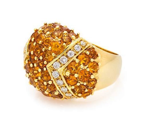 * An 18 Karat Yellow Gold, Citrine and Diamond Bombe Ring, 11.90 dwts.